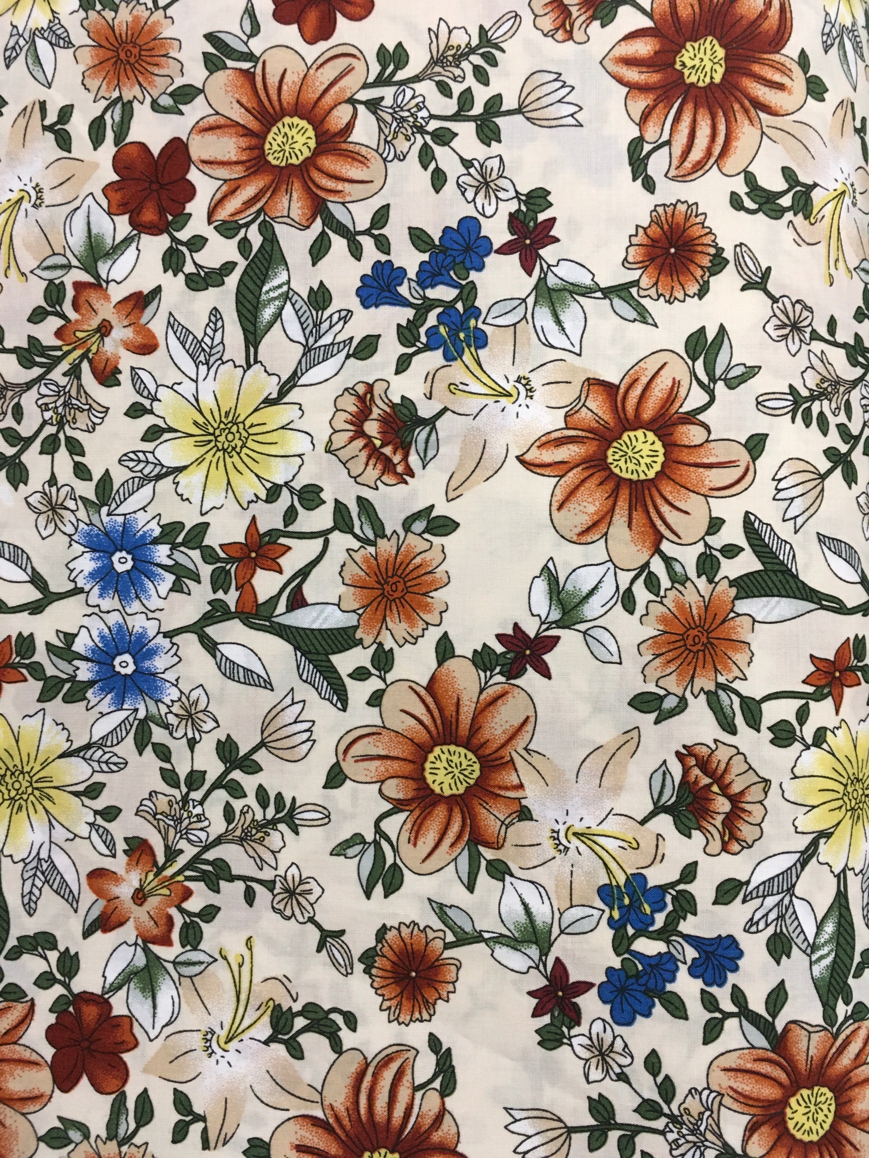 Brown and Blue Flowers Tan Background 56 inch Cotton Fabric